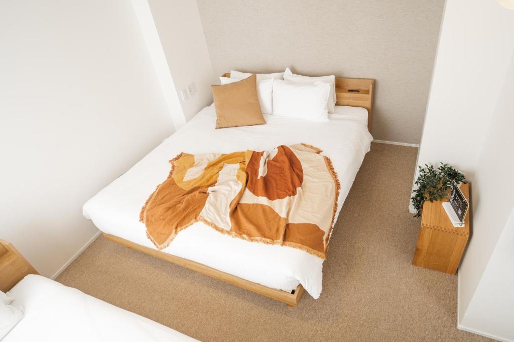 Postel nebo postele na pokoji v ubytování KABIN Minamiza