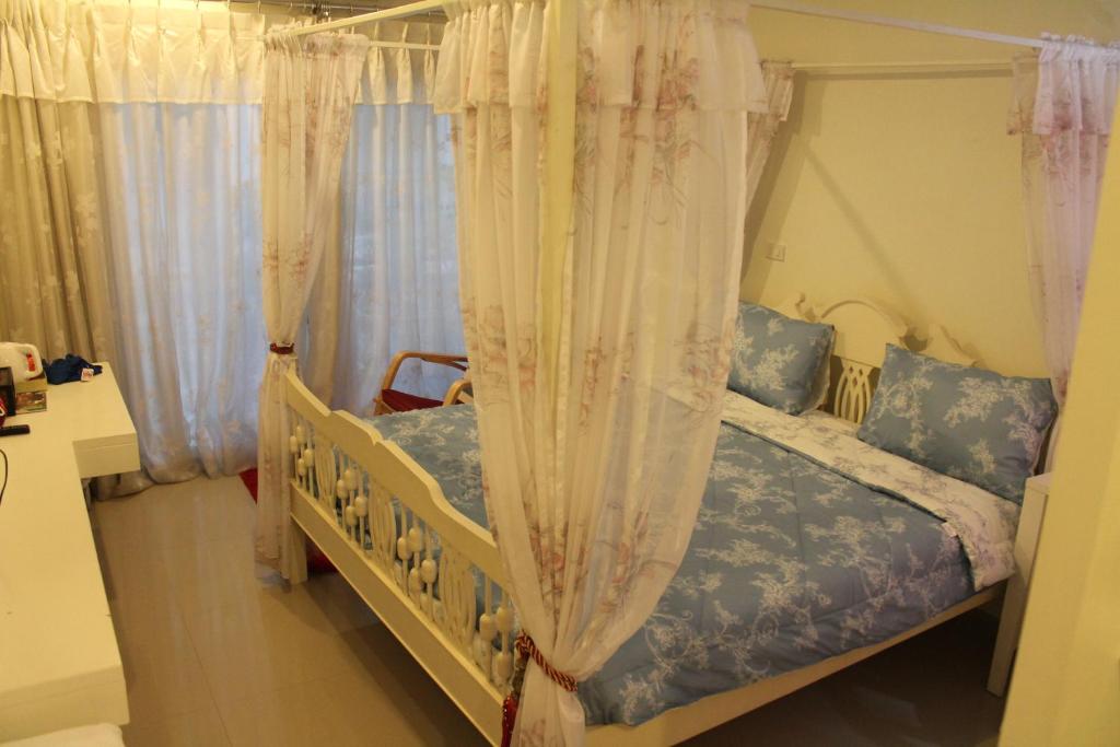 Postel nebo postele na pokoji v ubytování Huen Chan Thip