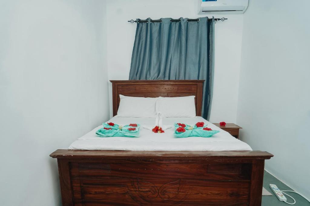 Postel nebo postele na pokoji v ubytování Tamu House Pajé Beach