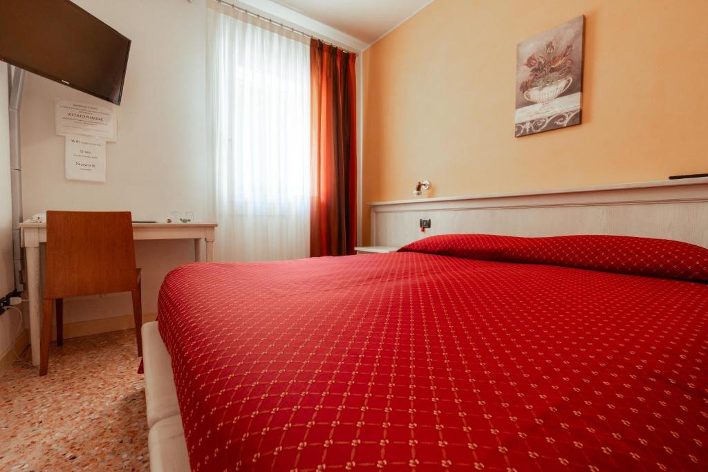 Postel nebo postele na pokoji v ubytování Albergo Corte di Emma