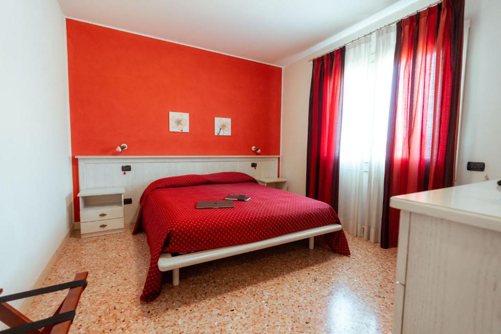 Postel nebo postele na pokoji v ubytování Albergo Corte di Emma