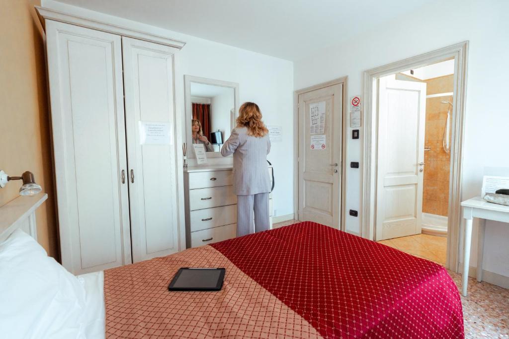 Postel nebo postele na pokoji v ubytování Albergo Corte di Emma