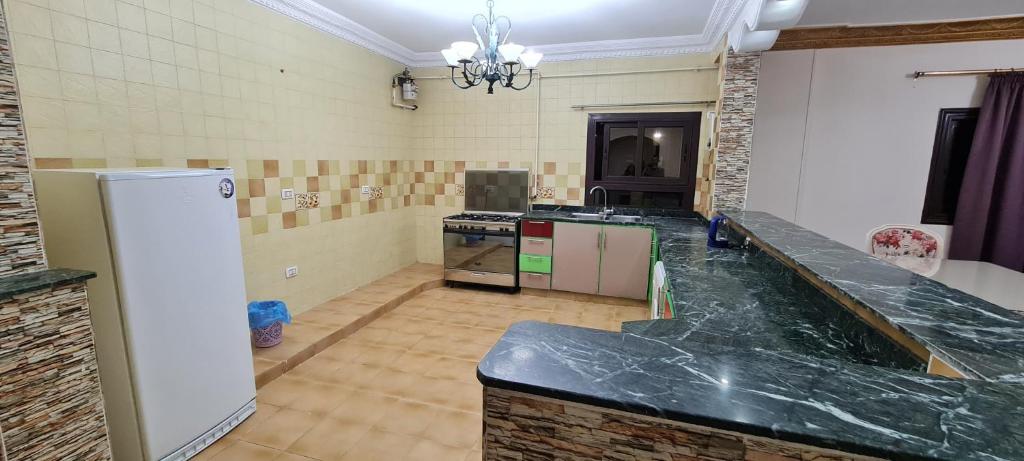 Kuchyň nebo kuchyňský kout v ubytování Cool appartement in a family house