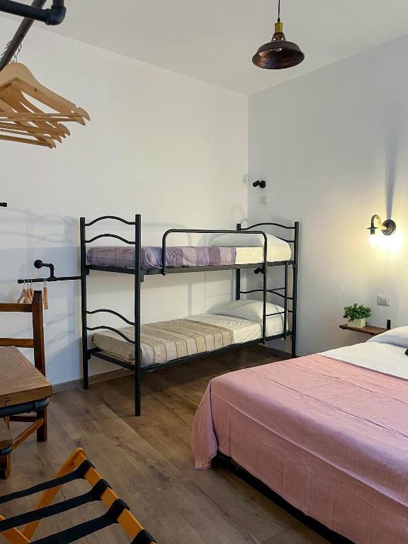 Postel nebo postele na pokoji v ubytování Trilli EcoBnB