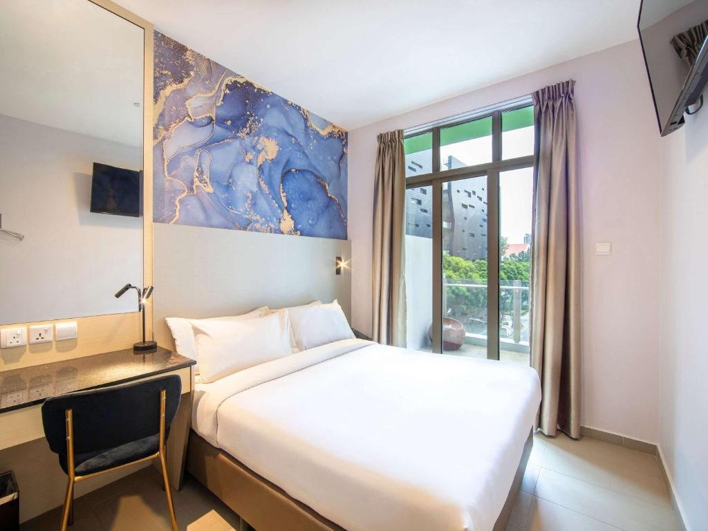 Postel nebo postele na pokoji v ubytování ibis Styles Singapore Albert
