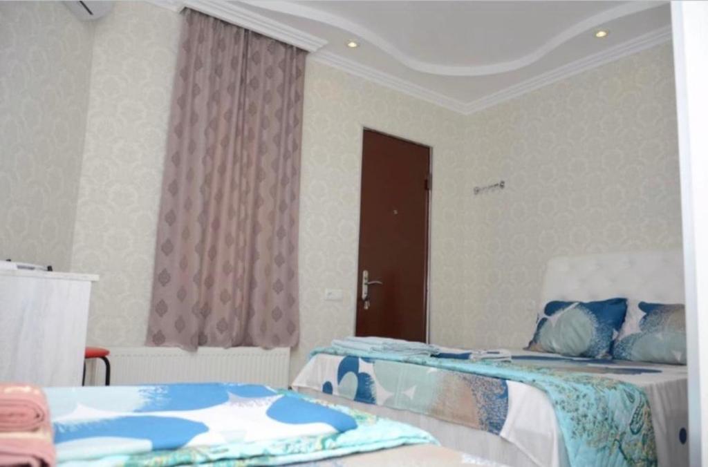 Postel nebo postele na pokoji v ubytování Kutaisi Best Guesthouse