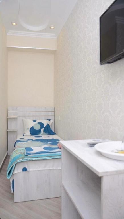 Postel nebo postele na pokoji v ubytování Kutaisi Best Guesthouse