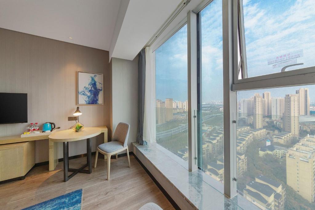 TV a/nebo společenská místnost v ubytování Echarm Hotel Wuhan Hanyang Wangjiawan Sixin Avenue Metro Station