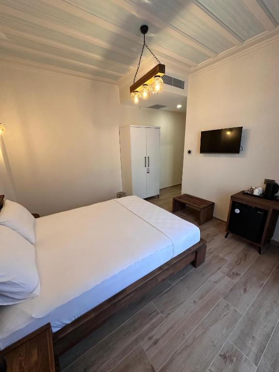 Postel nebo postele na pokoji v ubytování Cunda Nisa Otel
