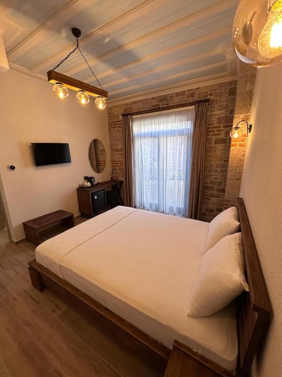 Postel nebo postele na pokoji v ubytování Cunda Nisa Otel