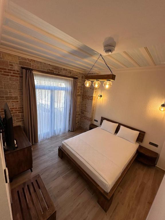 Postel nebo postele na pokoji v ubytování Cunda Nisa Otel