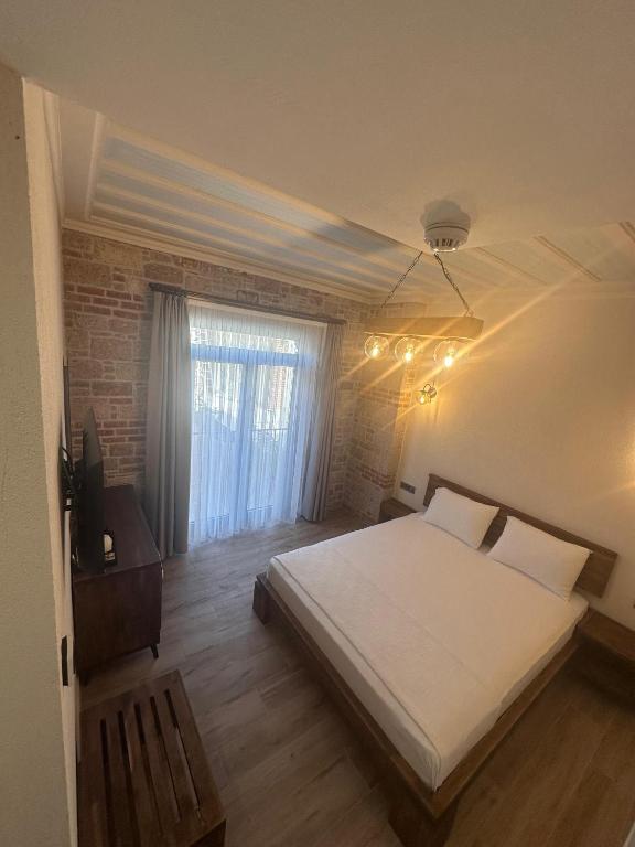 Postel nebo postele na pokoji v ubytování Cunda Nisa Otel