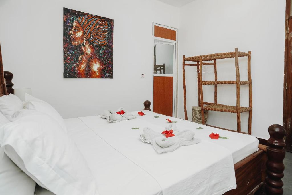 Postel nebo postele na pokoji v ubytování Tamu House Pajé Beach