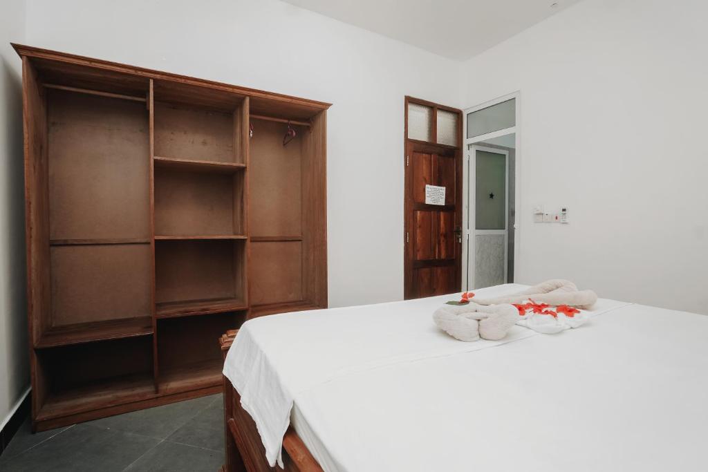 Postel nebo postele na pokoji v ubytování Tamu House Pajé Beach