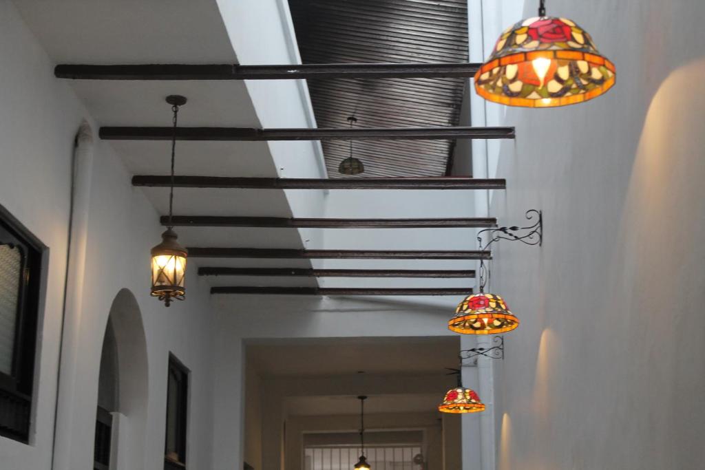 a row of lights hanging from a ceiling at Epoca Iquitos in Iquitos
