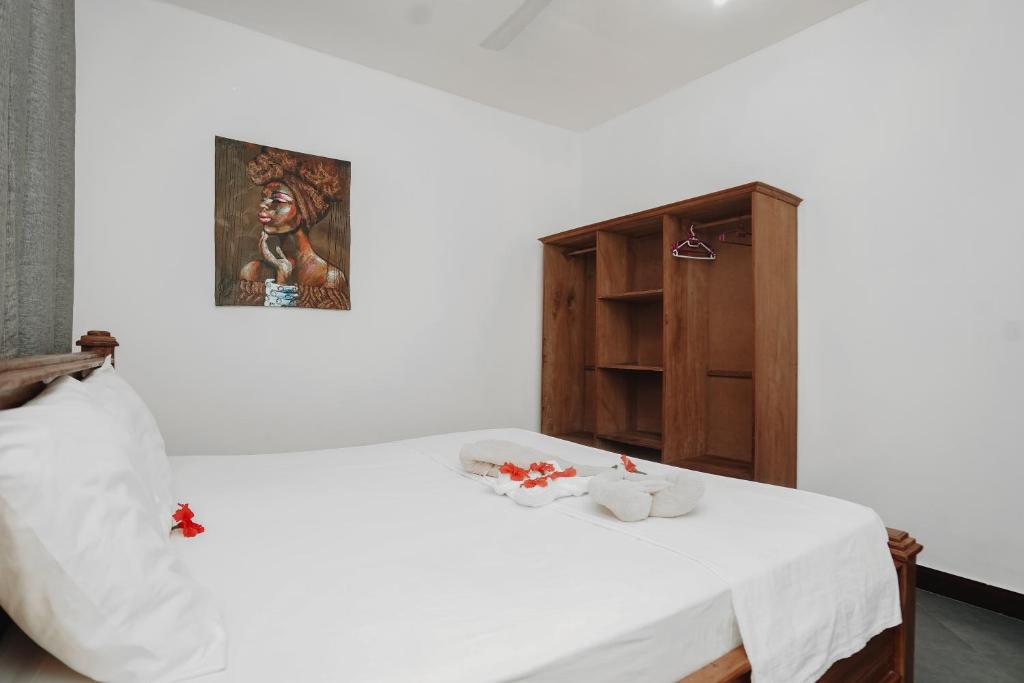 Postel nebo postele na pokoji v ubytování Tamu House Pajé Beach