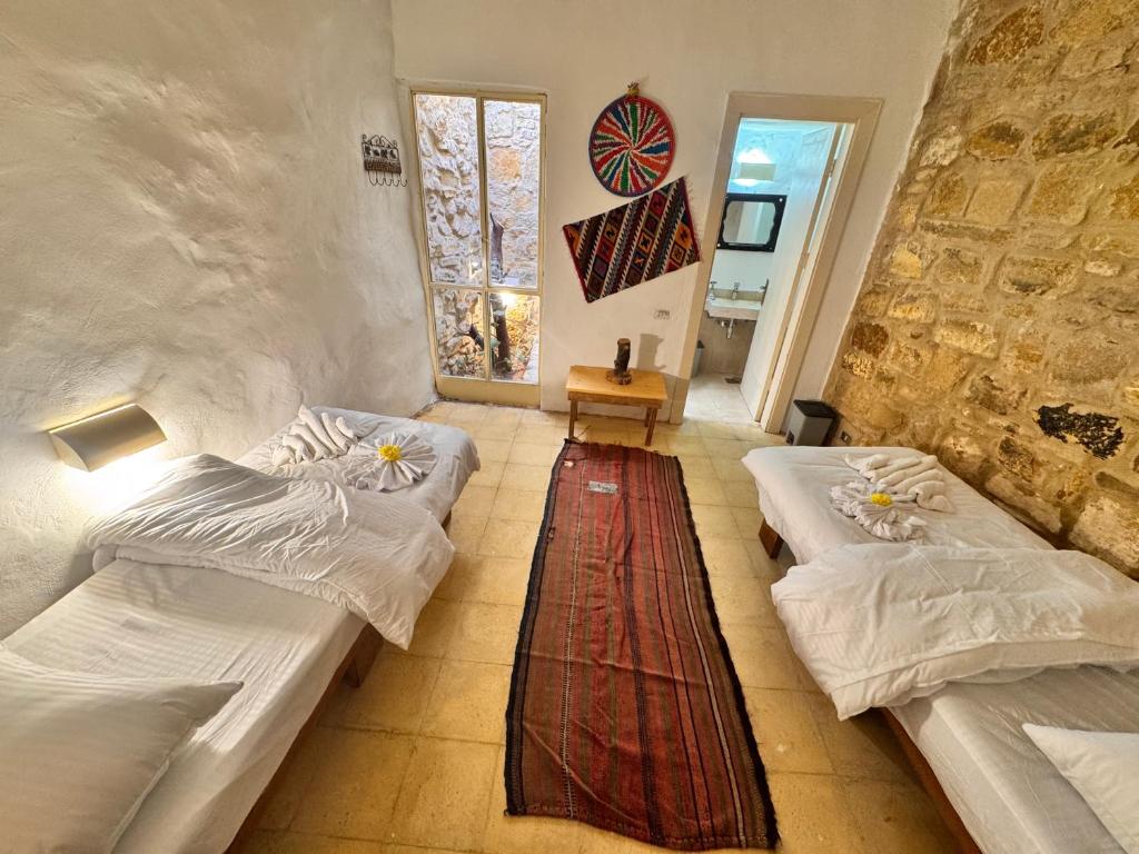 Postel nebo postele na pokoji v ubytování Dana Tower Hotel