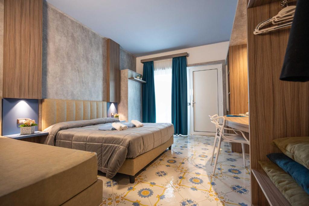 En eller flere senge i et værelse på Coral Beach Paestum