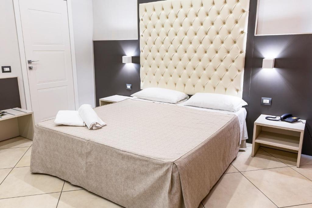 Postel nebo postele na pokoji v ubytování Hotel Demo'