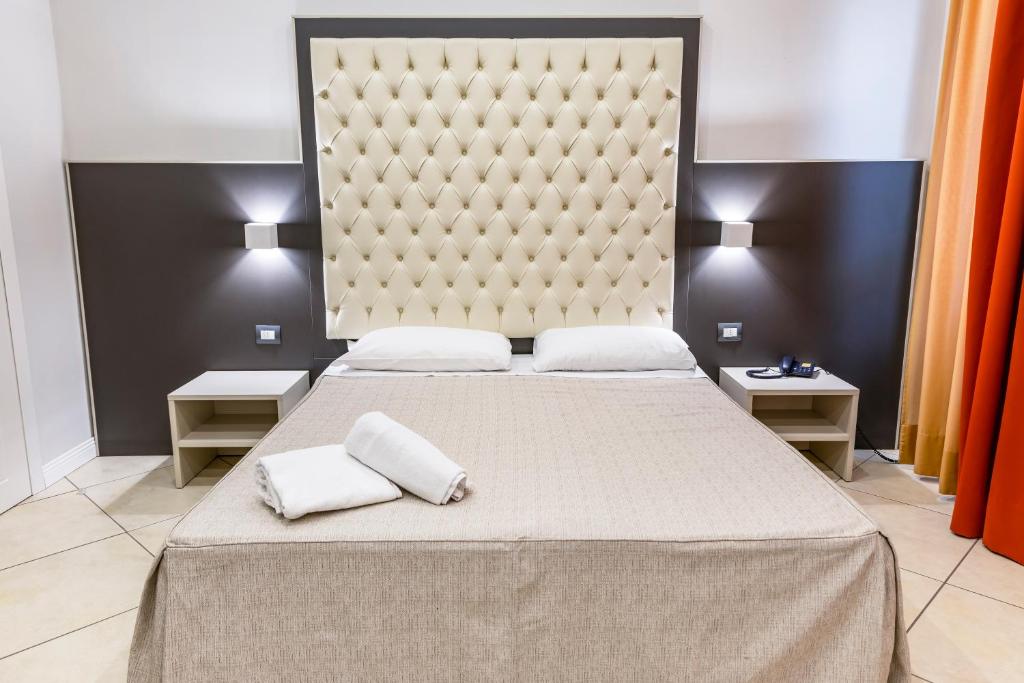 Postel nebo postele na pokoji v ubytování Hotel Demo'