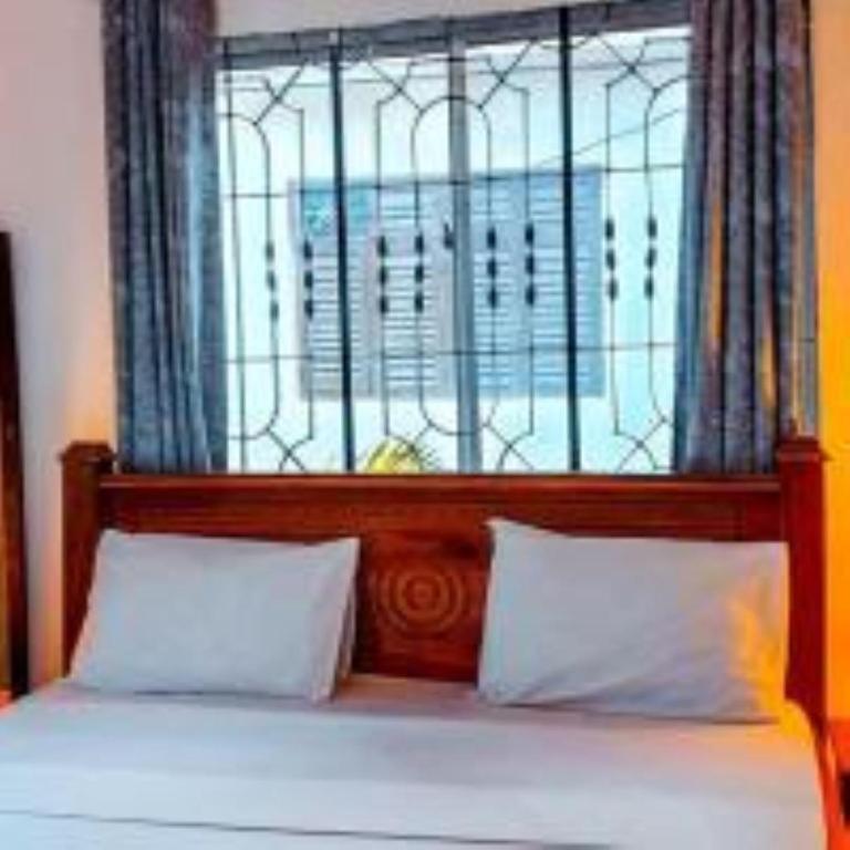 Postel nebo postele na pokoji v ubytování Tamu House Pajé Beach