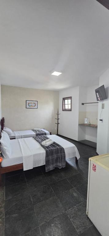 Cama ou camas em um quarto em Pousada Terra Do Sol