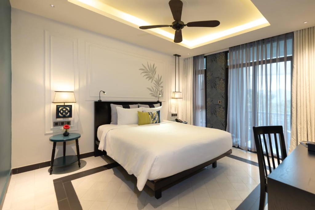 Giường trong phòng chung tại Maison Vy Hotel Hội An