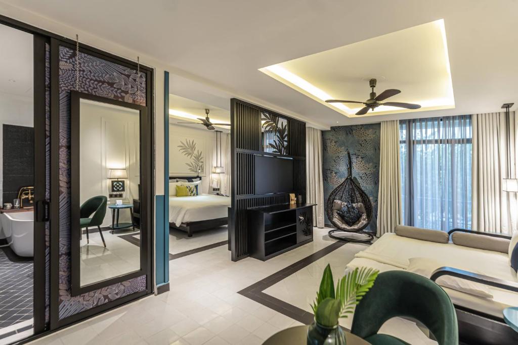 Postel nebo postele na pokoji v ubytování Maison Vy Hotel Hội An