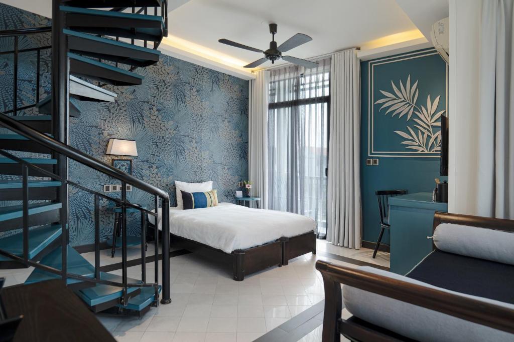 Postel nebo postele na pokoji v ubytování Maison Vy Hotel Hội An