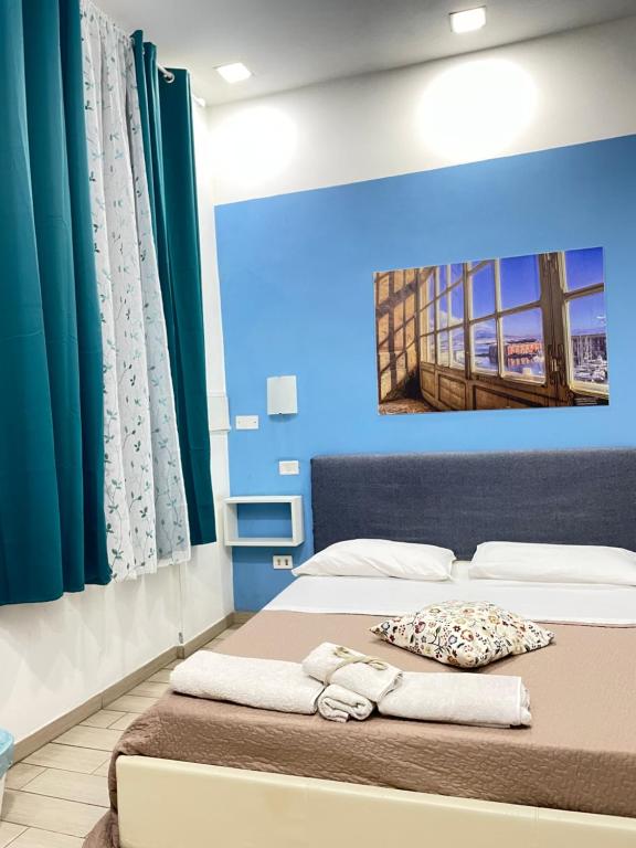 A bed or beds in a room at Decumani Prestige