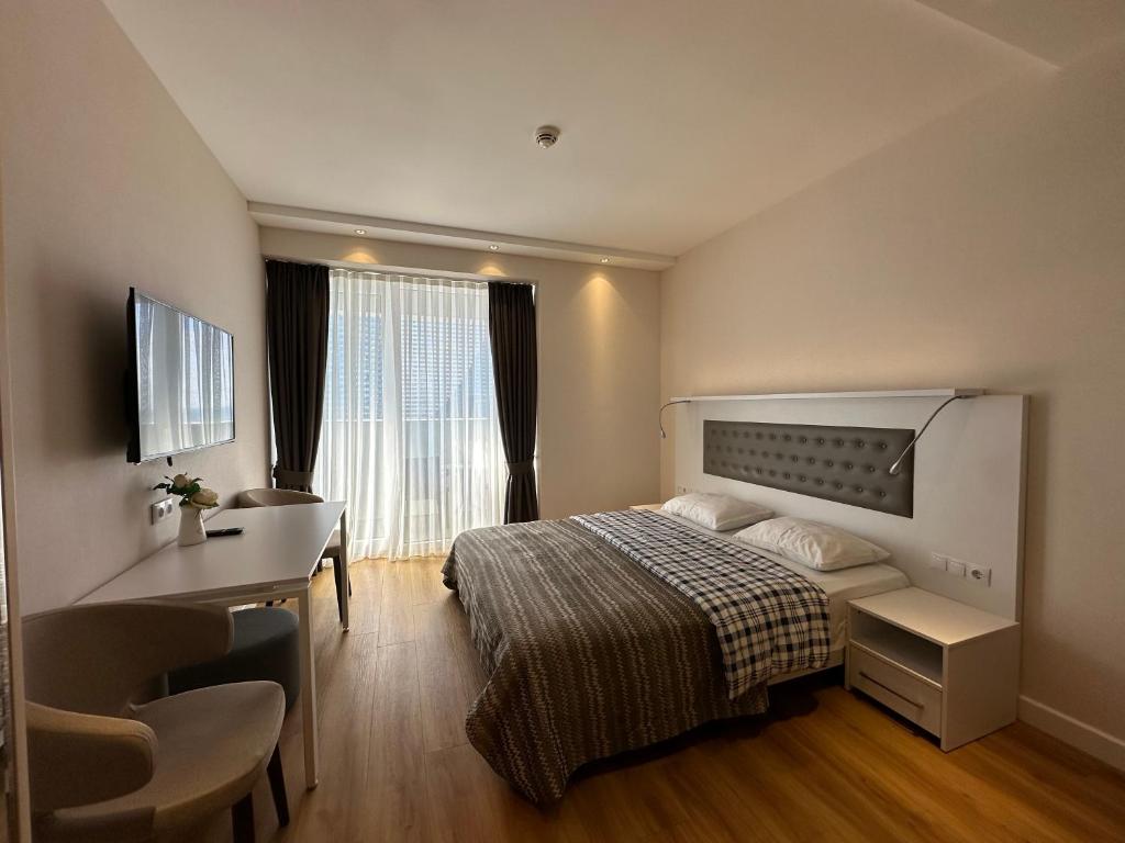 Postel nebo postele na pokoji v ubytování Alliance palace 18 floor