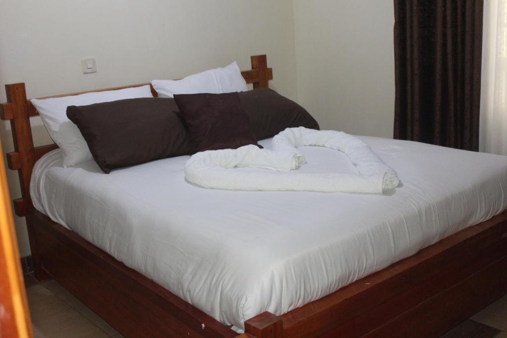 Voodi või voodid majutusasutuse Eshborns House - Near Jomo Kenyatta International Airport and SGR with shuttle services toas