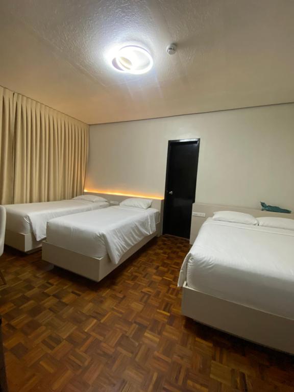 Postel nebo postele na pokoji v ubytování Honey Suite Room Inside Bee Cafe Cebu at Ayala Area