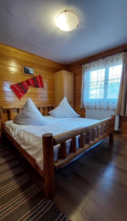 Postel nebo postele na pokoji v ubytování Cabana Dochita 2