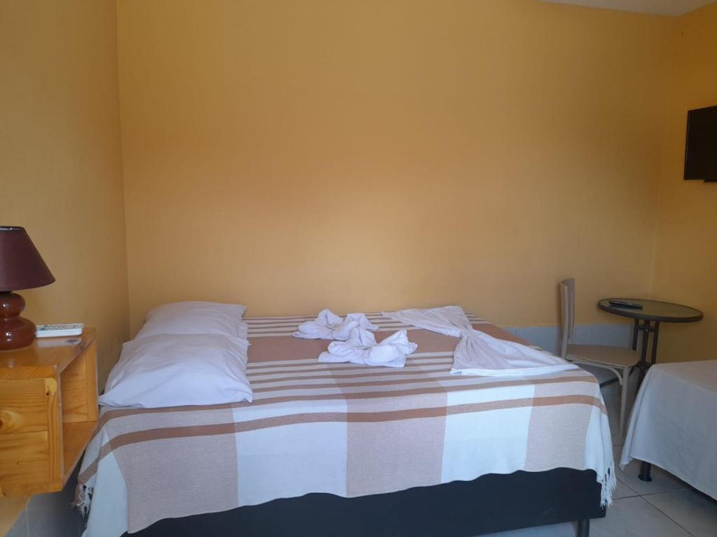 Cama ou camas em um quarto em Pousada Terrissol