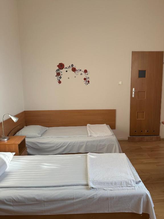 Postel nebo postele na pokoji v ubytování Hotel Haga