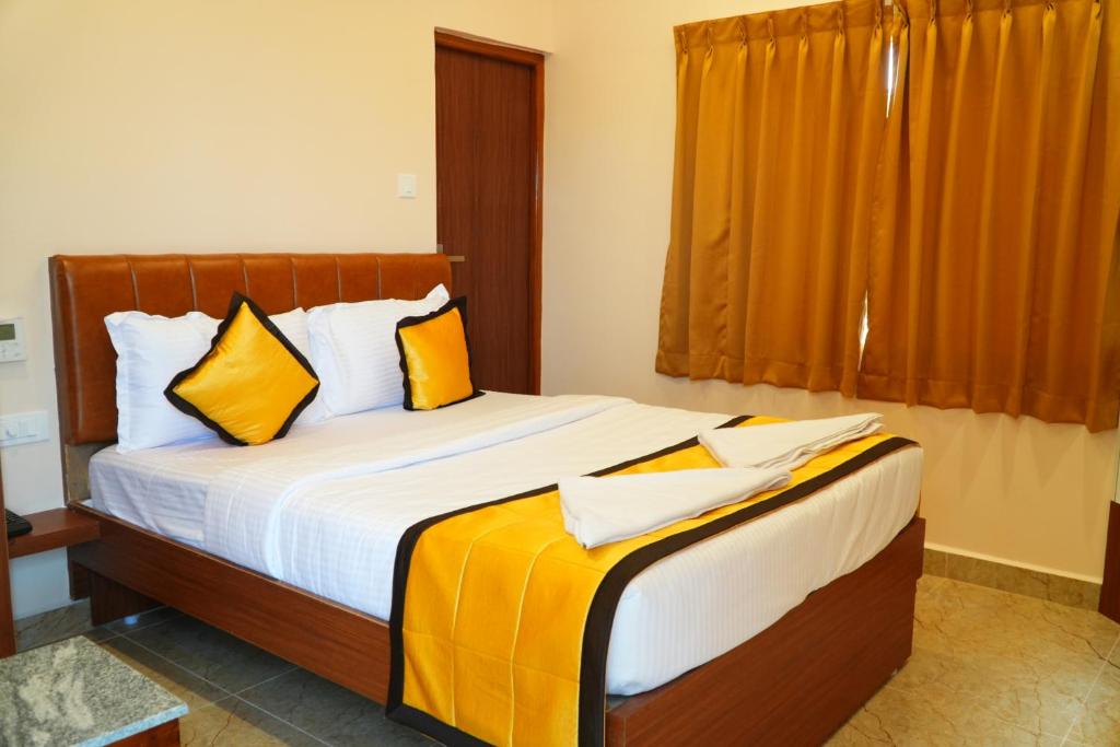 Postel nebo postele na pokoji v ubytování UJ Pallazzio - Business Class Luxury Hotel