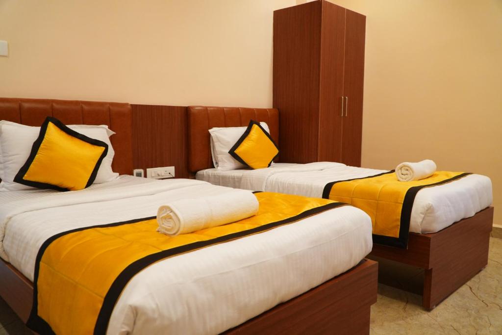 Postel nebo postele na pokoji v ubytování UJ Pallazzio - Business Class Luxury Hotel