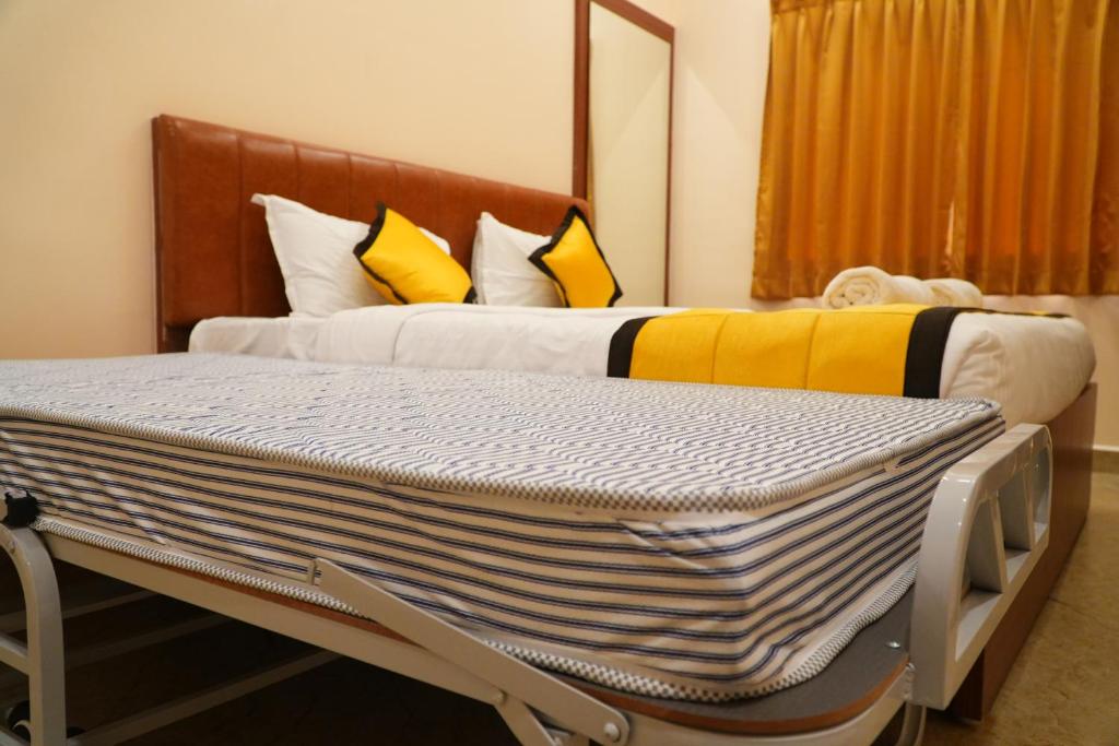 Postel nebo postele na pokoji v ubytování UJ Pallazzio - Business Class Luxury Hotel