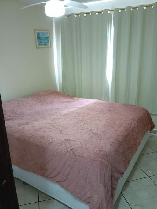 Postel nebo postele na pokoji v ubytování Prédio de frente para o mar