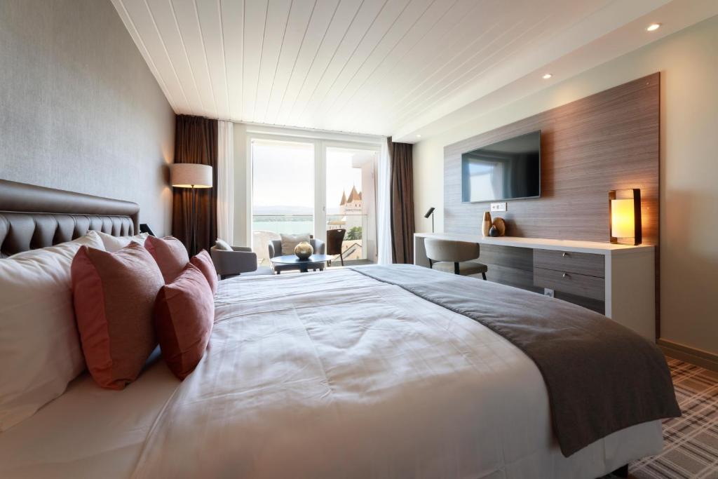 Postel nebo postele na pokoji v ubytování Ambassador Boutique Hotel