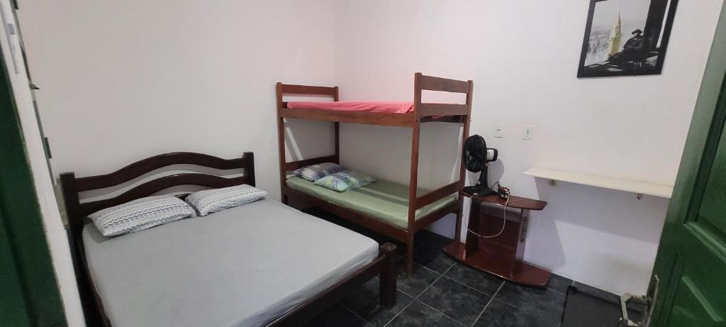 Postel nebo postele na pokoji v ubytování Recanto do Mar