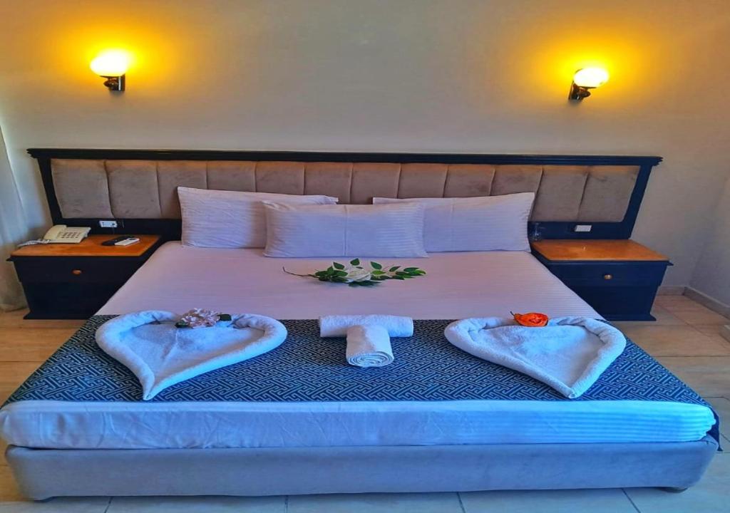 Postel nebo postele na pokoji v ubytování Davinci Beach Resort