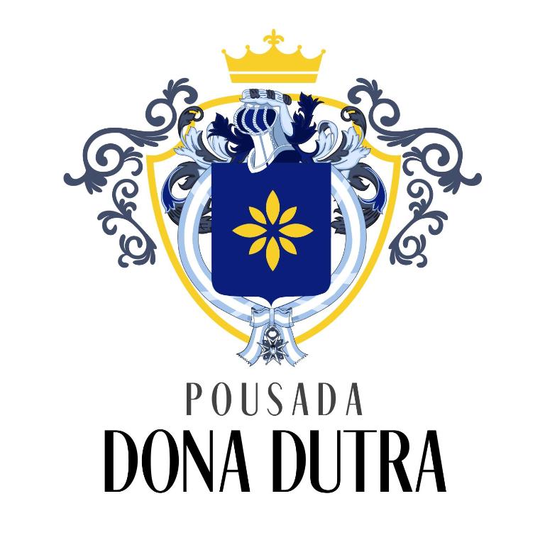 a shield with a royal crest and a crown at Pousada DONA DUTRA in Lençóis Paulista