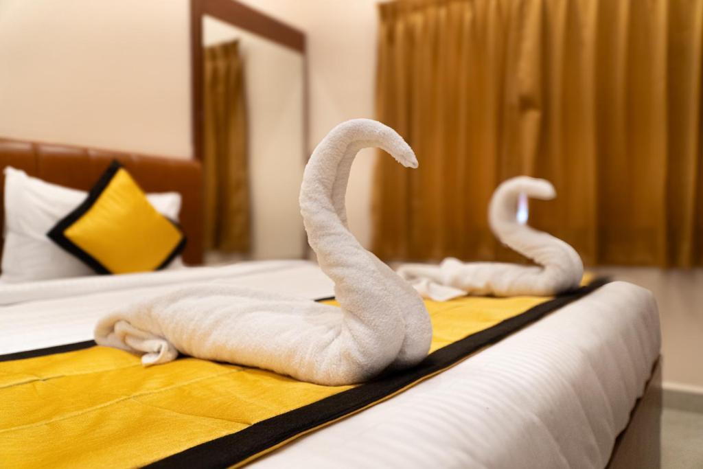 Postel nebo postele na pokoji v ubytování UJ Pallazzio - Business Class Luxury Hotel