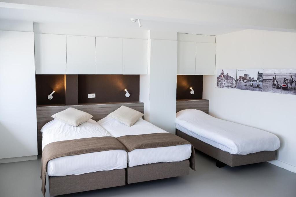 Postel nebo postele na pokoji v ubytování Rewindhotel