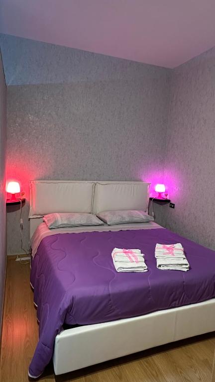 Postel nebo postele na pokoji v ubytování B&B Le Colombine