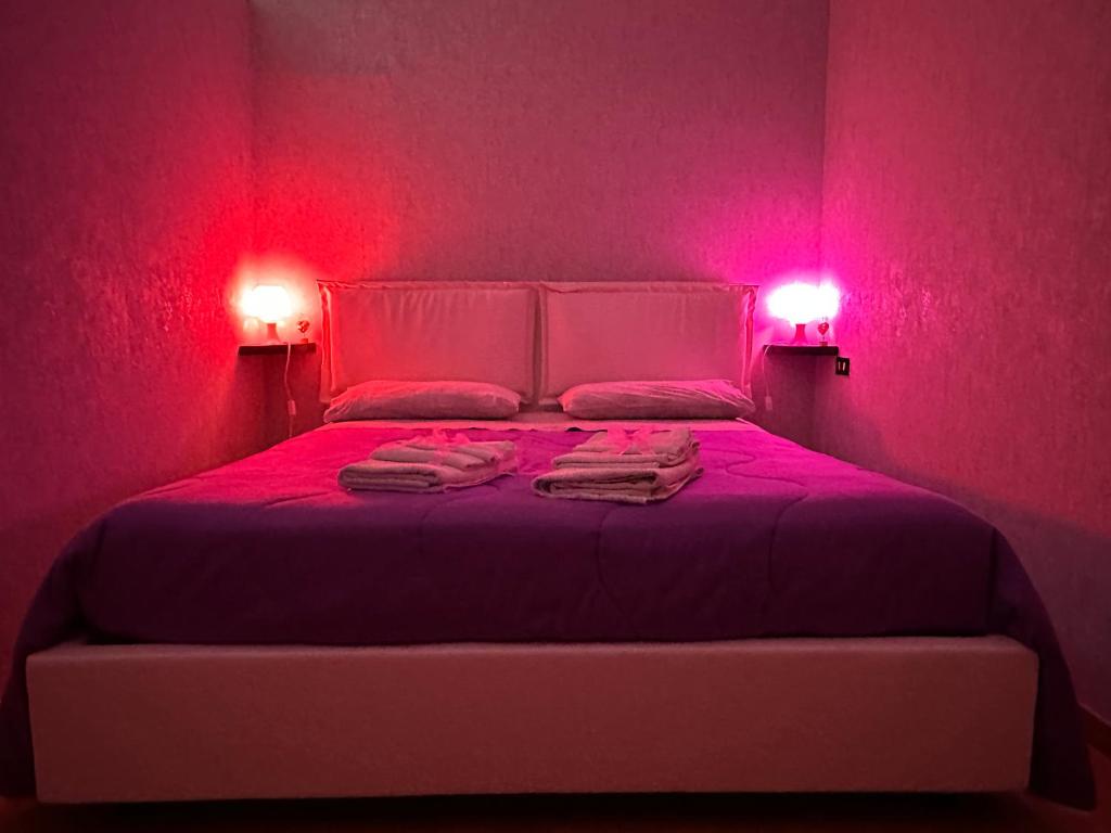 Postel nebo postele na pokoji v ubytování B&B Le Colombine