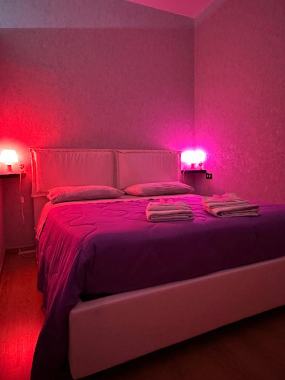 Postel nebo postele na pokoji v ubytování B&B Le Colombine