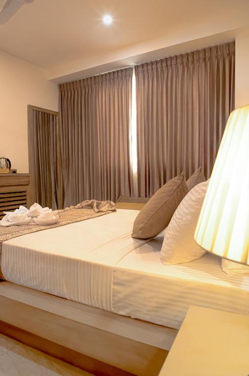 Postel nebo postele na pokoji v ubytování Ravo Hotel